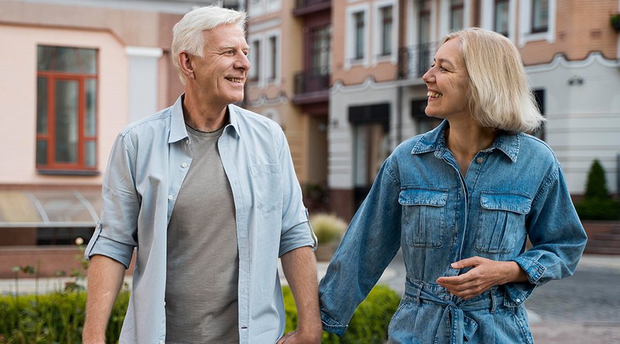 Older couple enjoying a walk through town
